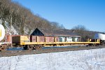 An empty stick-Rail car rides west on Q425